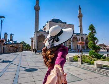women-tourists-holding-man-s-hand-leading-him-mosque-konya-turkey