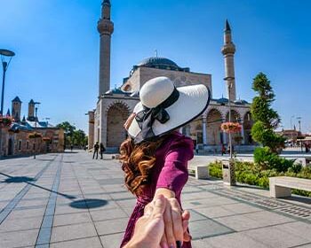 women-tourists-holding-man-s-hand-leading-him-mosque-konya-turkey